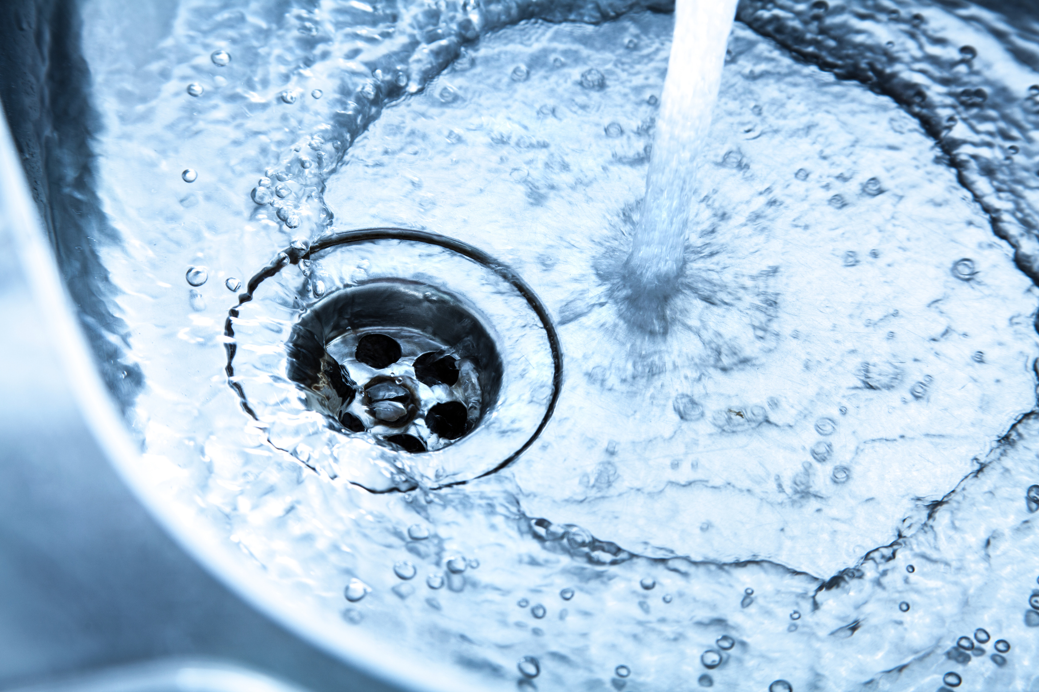 image of water draining from sink