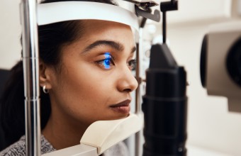 An image of a woman getting an eye exam. 